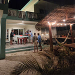 men playing pepper pong during getaway to beach