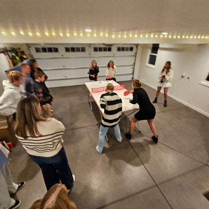 holiday gathering pepper pong tournament in garage