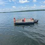 two friends swimming and playin pepper pong on floating doc